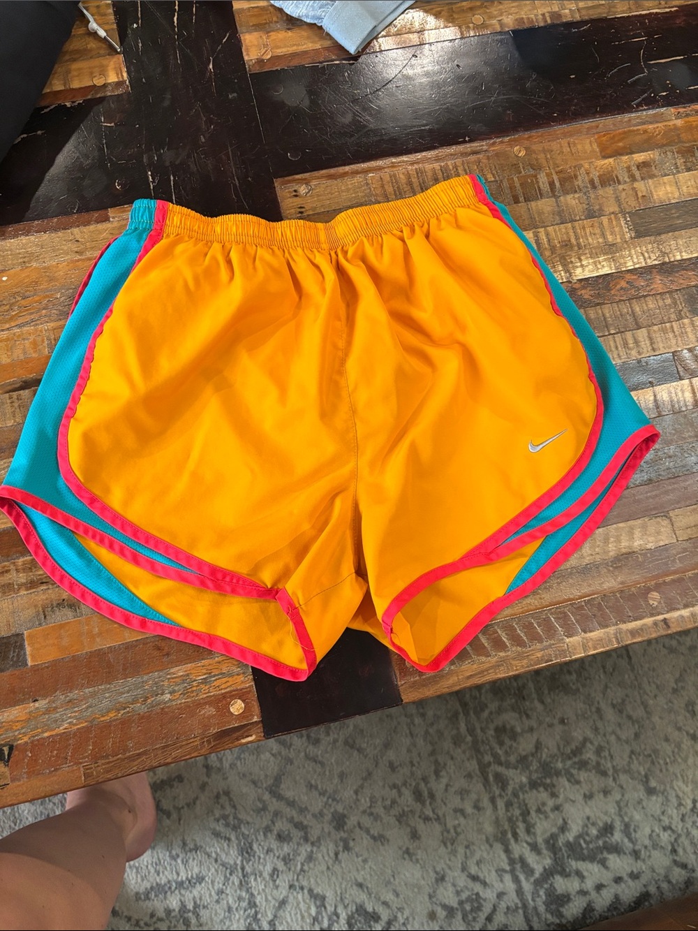 Nike Women’s Bright Orange Running Shorts with Teal Panels and Pink Trim
